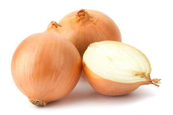 Fresh bulbs of onion on a white background